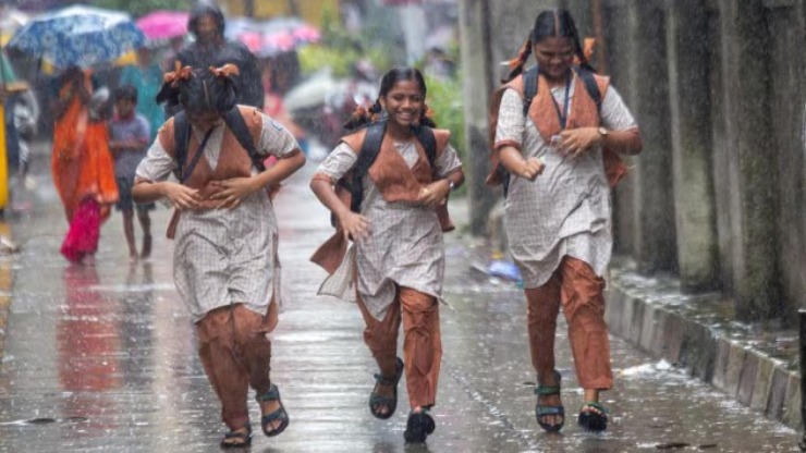 "NDRF team assisting people during Gujarat rains in Saurashtra region, June 2025"